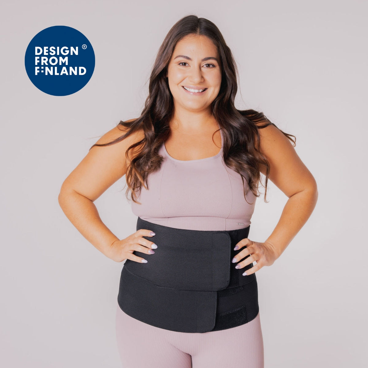 wearing a maternity clothes and postpartum belly band