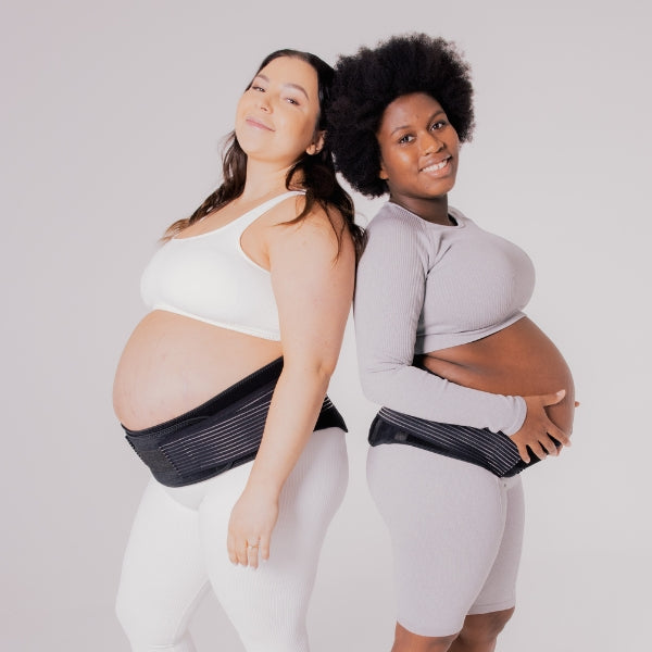 two pregnant mother wearing support belt