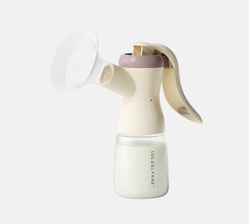 Lola&Lykke Manual Breast Pump on white background, from the left side