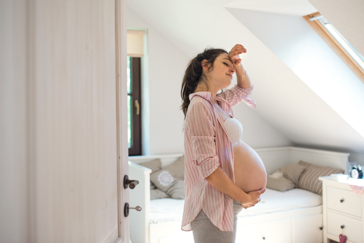 Pregnant woman feeling weak and fatigued due to the lack of iron