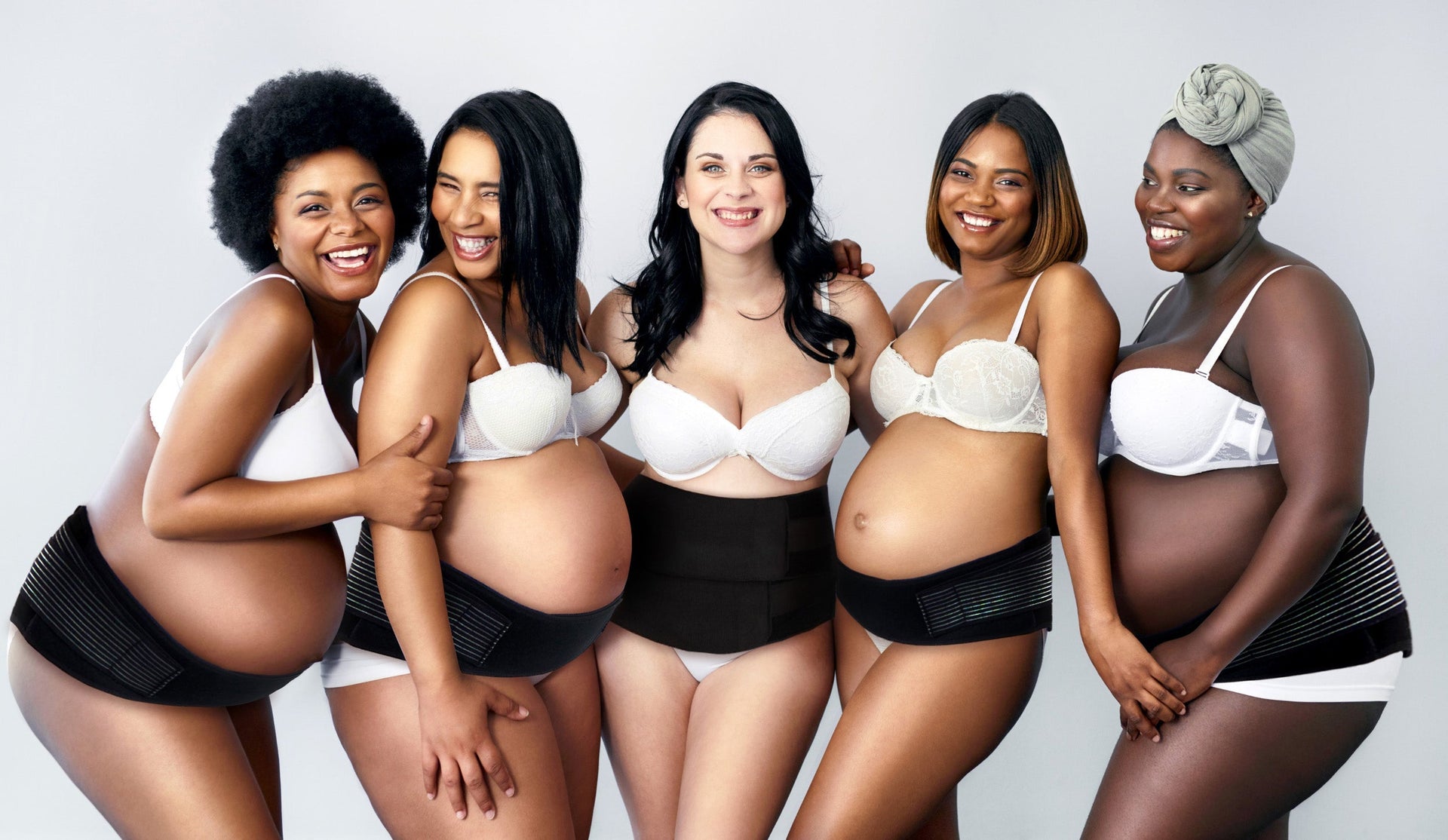 Mothers posing while wearing Lola&Lykke Core Relief Pregnancy Support Belt and Core Restore Postpartum Support Band