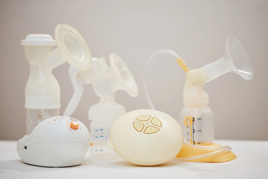 Various breast pumps displayed on a table.