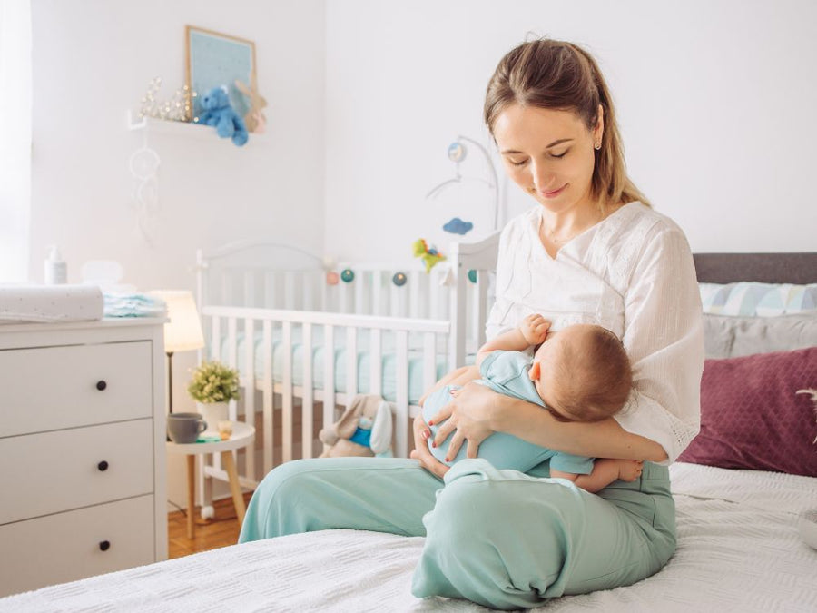 Mother breastfeeding and a guide for breastfeeding mums returning to work