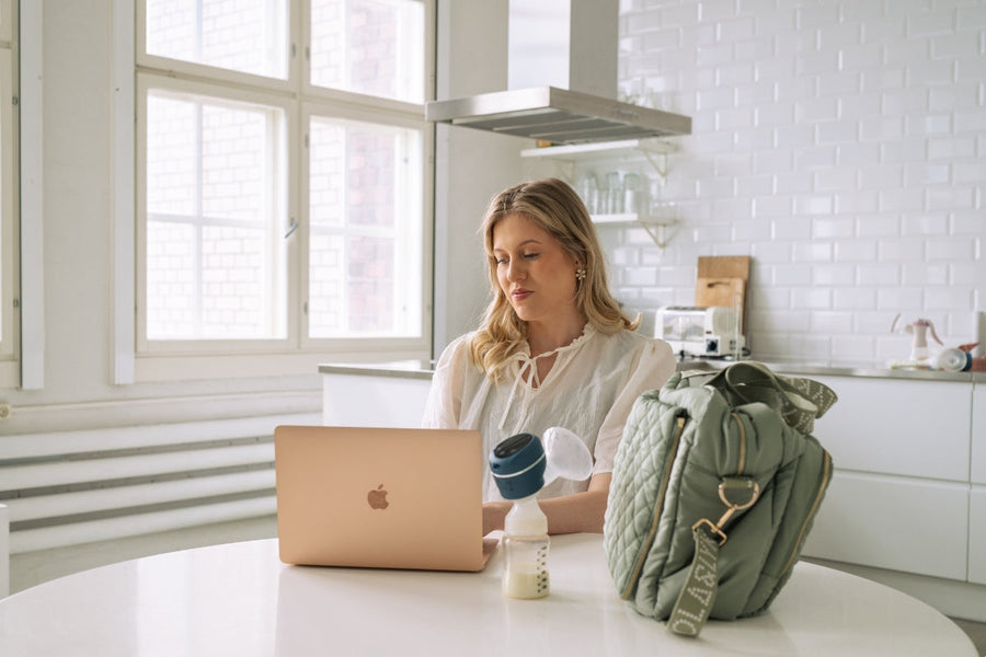 Working mum using wireless breast pump at home in the UK