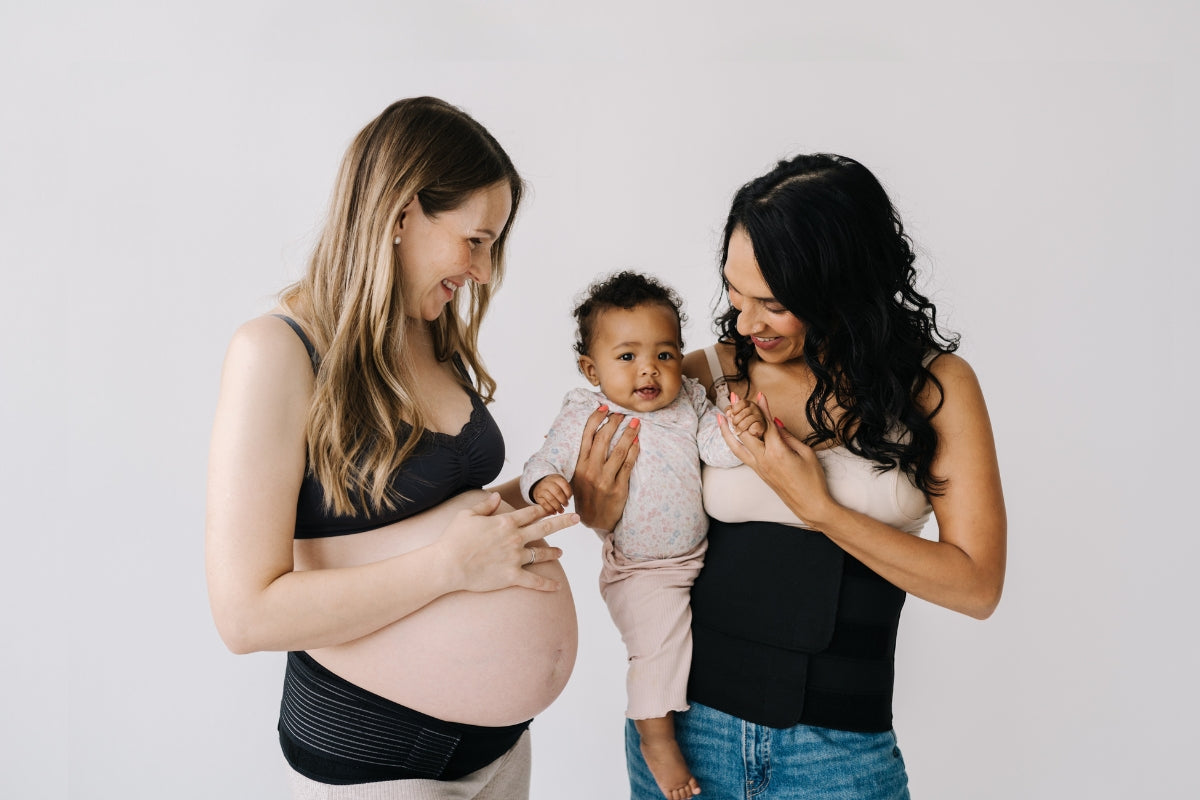 Two mums demonstrating Lola&Lykke's postpartum and pregnancy support belts for comfort and relief.