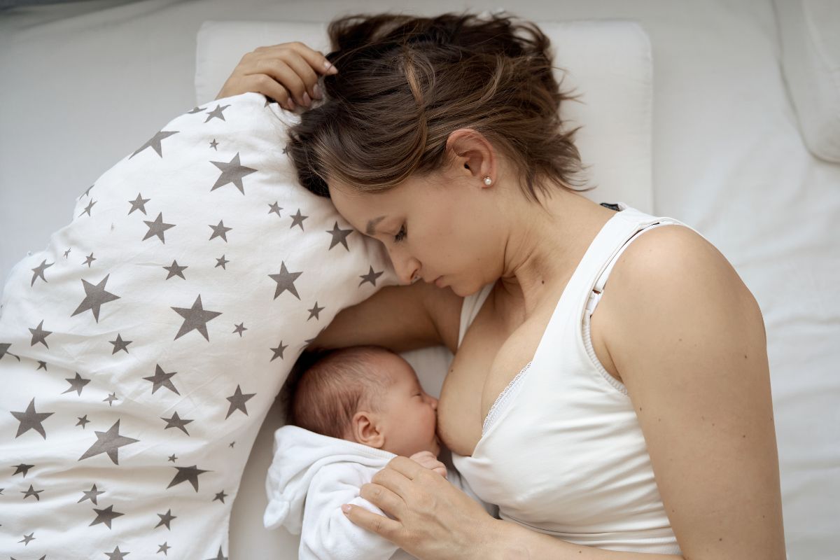 Mom breastfeeds her baby during a cluster feeding session