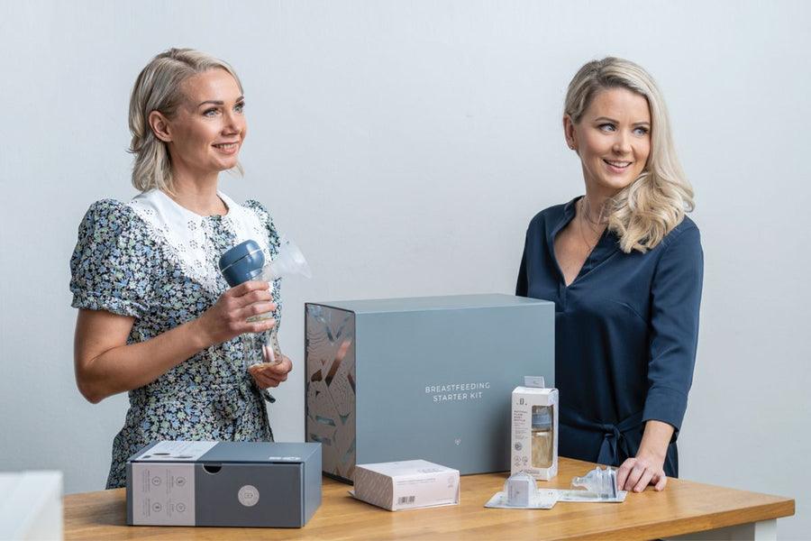Founders Laura and Kati holding Lola&Lykke products