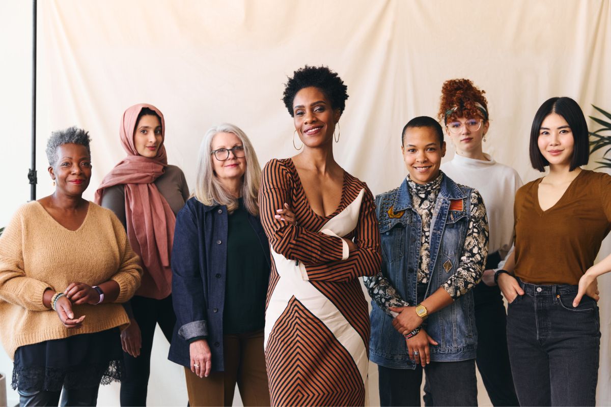 Seven women from different backgrounds celebrating International Women’s Day