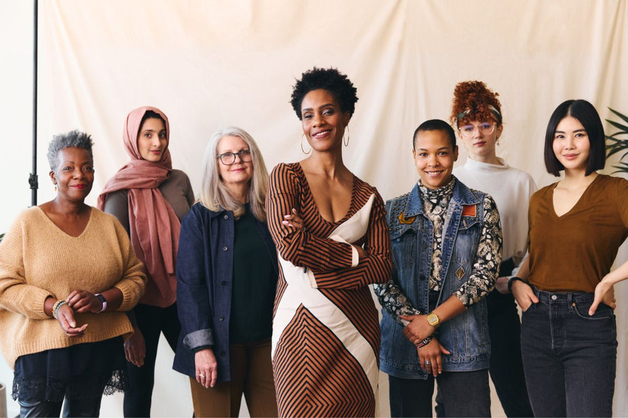Seven women from different backgrounds celebrating International Women’s Day