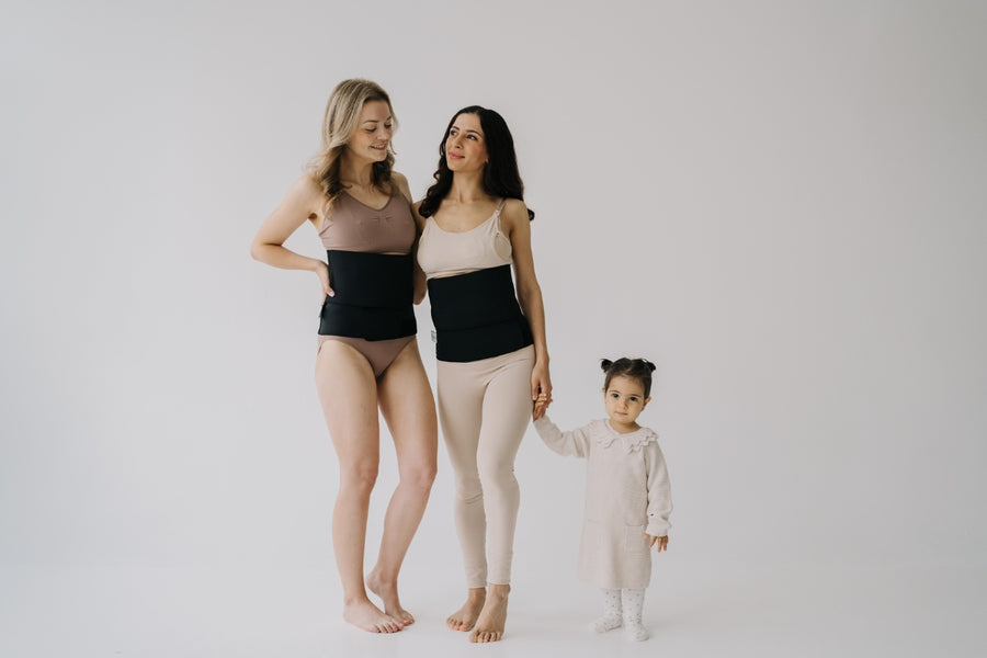 Two mothers wearing the Lola&Lykke postpartum support belt to restore their core after pregnancy.